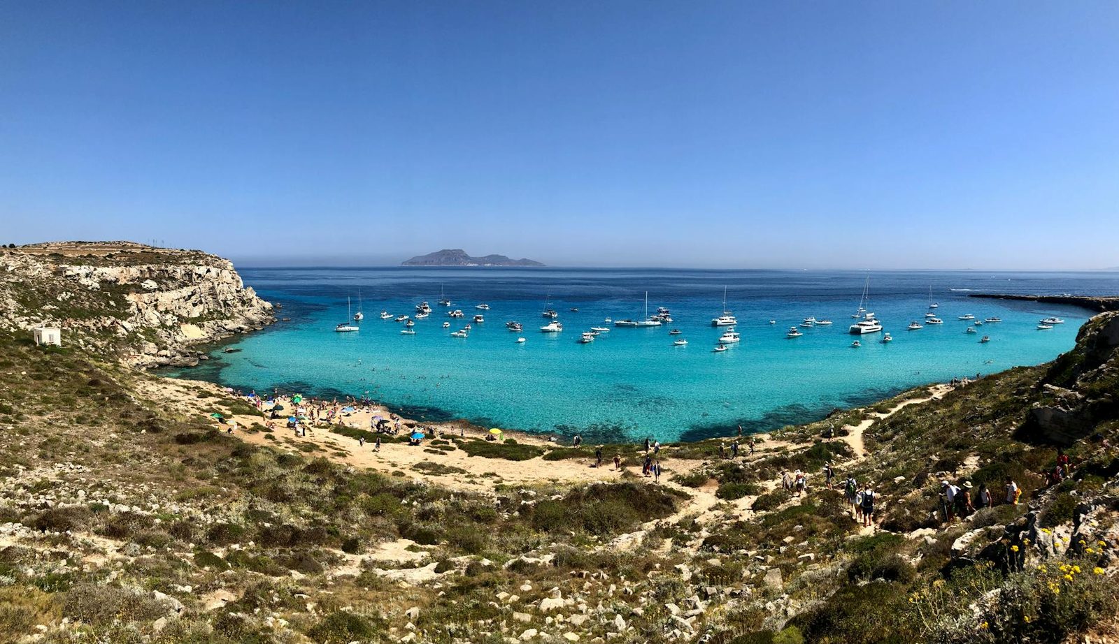 Yacht at anchor in turquoise water