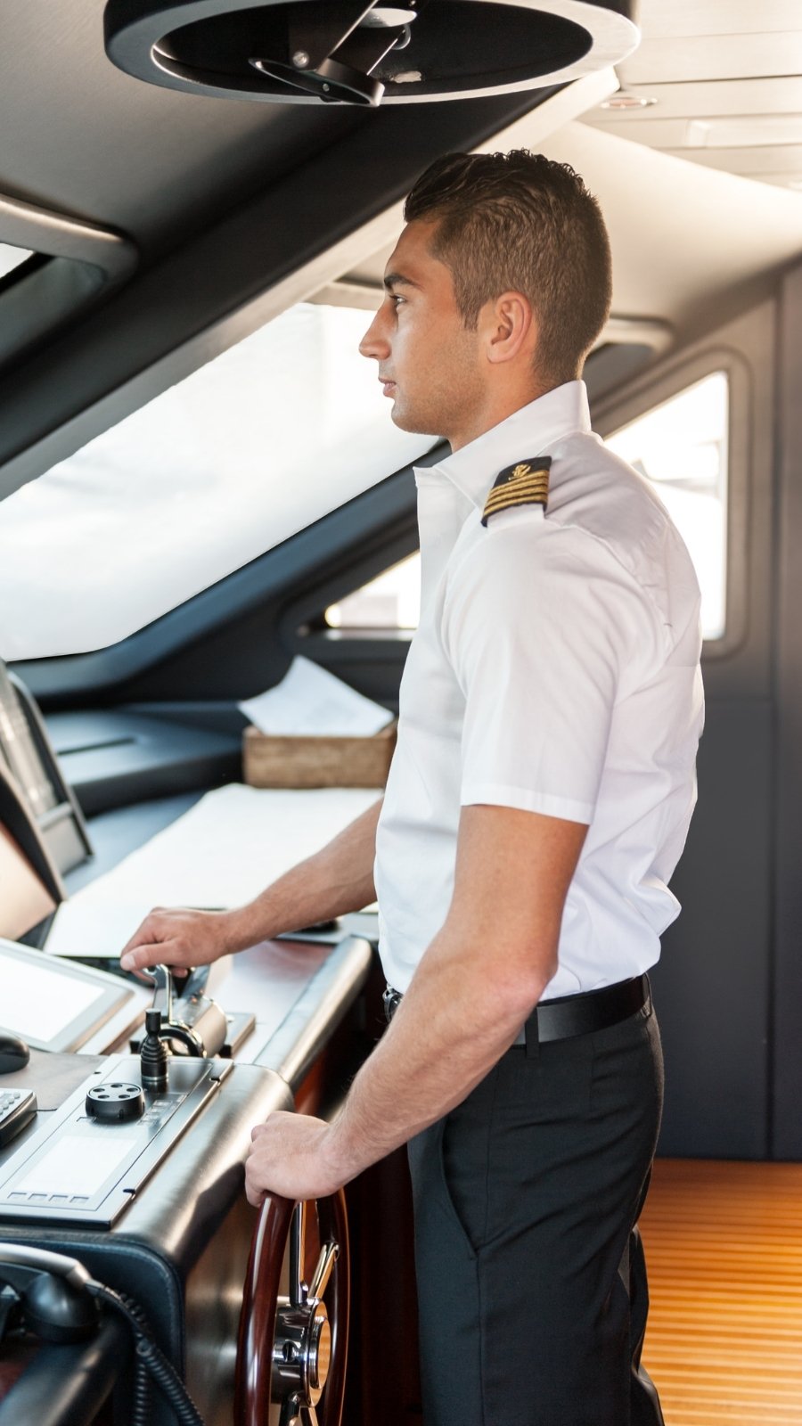 Yacht captain at the helm